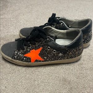 Golden Goose Women's Black Glitter Sneakers with Orange Star